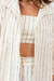 camisa oversized com botão listrada