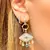 Brinco ear bling olho cristal ametista banho de ouro 18k nano gold - comprar online