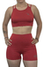 Conjunto deportivo rojo liso corto para mujer, compuesto por top sin mangas y short ajustado