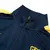 Jaqueta Corta-Vento Barcelona 25/26 - Masculina Nike - Azul com detalhes em vermelho e amarelo