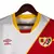 Camisa Rayo Vallecano I 23/24 - Torcedor Umbro Masculina - Branca com detalhes em vermelho e amarelo