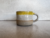 xícara “era veneno” branco com amarelo - comprar online