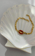 Pulseira búzio resinada