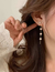 Aretes largo de moño y perlas