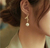 Aretes de moño y perla colgante