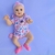 A Bebê Reborn April encanta com seu rostinho alegre e expressão doce, que transmite a pureza e a alegria de um verdadeiro bebê.