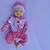A Bebê Reborn Rosalie encanta com seu rostinho alegre e expressão doce, que transmite a pureza e a alegria de um verdadeiro bebê.