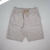 Bermuda sarja masculina de cor clara com bolso faca e cordão na cintura.