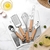 Set De Utensilios De Cocina 9 Piezas Mango De Madera Y Acero Inoxidable (S) - PRINI 