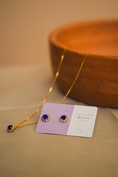 Brinco Pedra Azul Cravejado Dourado na internet
