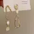 Brincos Moda Minimalista Assimétrico longo Barroco Com Pérolas - comprar online
