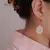 Brincos Aurora de Pérolas Barroca de Água Doce na internet