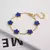 Pulseira Ajustável Aço Inoxidável Banhada a Ouro com Elegante Design de Flor. - loja online
