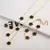 Pulseira Ajustável Aço Inoxidável Banhada a Ouro com Elegante Design de Flor. - Flev d'Or
