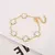Pulseira Ajustável Aço Inoxidável Banhada a Ouro com Elegante Design de Flor. - Flev d'Or