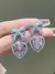 Par de aros con cristal de corazon rosa y lazo - comprar online