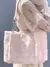 bolso rosa de peluche con corazones