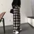 Imagem do Calça preta xadrez oversized