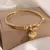 TitanHeart – Pulseira Dourado com Pingente de Coração
