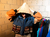 Imagen de Chaqueta mini supra en escala de jean y naranja con nueve bolsillos a partir de material recuperado