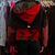 Chaqueta mini supra rojo con negro con nueve bolsillos a partir de material recuperado - TRANS