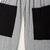 Pantalon upcycling sudadera gris con bolsillos negros en internet