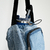 Imagen de Portabotellas de upcycling en tonos claros