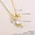sun moda meninos e meninas charme colar banhado a ouro zc zircão oco pingente c - comprar online