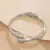 Imagem do Espiral de Estilo – Pulseira Anel Unissex com Design Torcido em Metal Largo