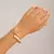Espiral de Estilo – Pulseira Anel Unissex com Design Torcido em Metal Largo