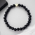 Pulseira Ônix 6mm Coração Dourado - comprar online