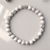 Pulseira Howlita Branca 6mm Detalhe Prata na internet