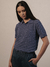 Image of Playera Cuadros Desaforados Cuello Polo Mujer