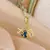 Imagem do Colar Estrela Celestial – Aço Titânio Dourado com Design Astral de Planeta