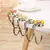 Flor de Mesa Hook: Suporte Elegante para Bolsas na internet