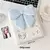 Imagem do Álbum Fofura K-Pop A6 – Porta Photocard com Capa de Pelúcia de Gato e Cachorro