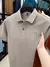 Marca de luxo 100% algodão camisa polo masculina lapela carta impressão manga curta verão 2025 nova tendência da moda magro camiseta masculina topo - NK Mega Stor