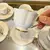Jogo de Xícaras para Café em Porcelana Branca com Detalhes em Dourado Mon Charmant da L’Hermitage 12 Peças - 90 ml na internet