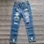 Imagem do Calça jeans rasgada estilo jogador