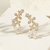 BRINCO EAR CUFF JARDIM FLORES ZIRCÔNIA BRANCA - comprar online