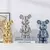 Decoração de cerâmica de urso Dourado em estilo tijolo estético na internet