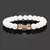 Pulseira Masculina de Pedra Vulcânica com Pingente de Haltere – Estilo e Força no Seu Pulso - Plenoy