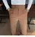 calça de alfaiataria masculina casual de cintura alta e perna reta na internet