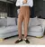 calça de alfaiataria masculina casual de cintura alta e perna reta na internet