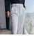 calça de alfaiataria masculina casual de cintura alta e perna reta na internet