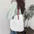 Bolsa Urban Chic – Couro & Lona com Alça Superior Estilo Luxo na internet