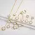 Conjunto Premium Trevo Dourado 18k – Elegância em 3 Peças | Joias que refletem sua essência luxuosa.| Luxo, requinte, exclusividade, brilho - comprar online