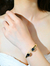 BRACELETE DOURADO COM ZIRCÔNIA CÚBICA AZUL MARINHO - loja online