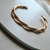 Bracelete trançado semi joia em ouro 18K na internet