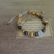 Imagen de Pulsera Palo Santo, Pirita y dije de San Benito "Protección, Abundancia, Bienestar emocional"
